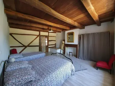 Un ou plusieurs lits dans un hébergement de l'établissement Gîte de l'Etrier 3 * : Le calme à la campagne !