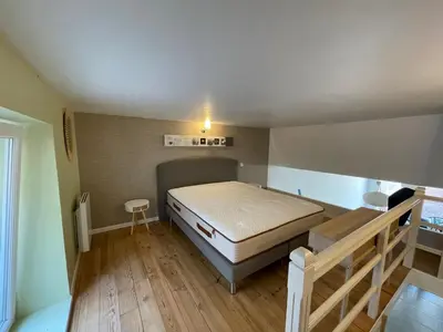 Un ou plusieurs lits dans un hébergement de l'établissement L’EFFERVESCENT