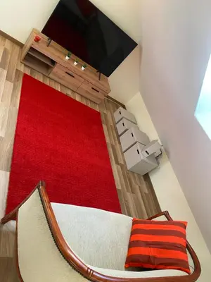 Télévision ou salle de divertissement dans l'établissement Les volets bleus