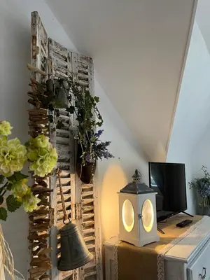 Télévision ou salle de divertissement dans l'établissement VILLA NOTRE DAME face au Château fort
