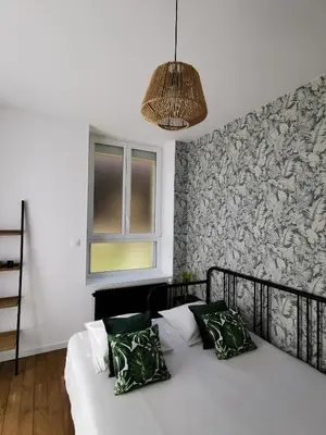 Un ou plusieurs lits dans un hébergement de l'établissement Appartement La palette