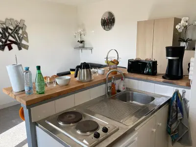 Cuisine ou kitchenette dans l'établissement Appartement chaleureux , cosy, bien équipé et bien placé