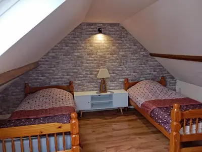 Un ou plusieurs lits dans un hébergement de l'établissement Maison au calme