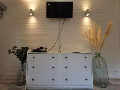 Télévision ou salle de divertissement dans l'établissement Au Chalet de la Nature