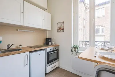 Cuisine ou kitchenette dans l'établissement Joli studio Le Cocon des Arènes, Roosevelt Arèna