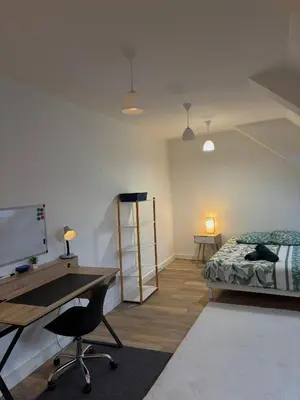Un ou plusieurs lits dans un hébergement de l'établissement Appartement spacieux et élégant