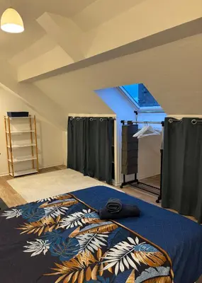 Un ou plusieurs lits dans un hébergement de l'établissement Appartement spacieux et élégant