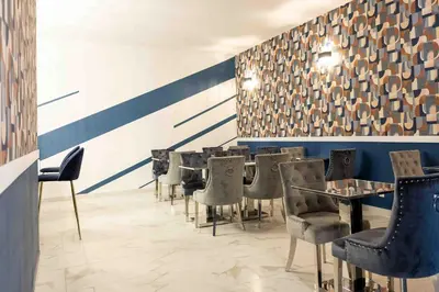 Coin salon dans l'établissement Hôtel Center Saint-Quentin Centre Gare 24-24