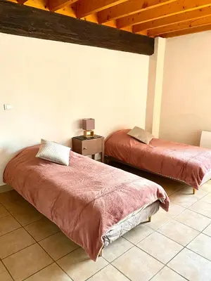 Un ou plusieurs lits dans un hébergement de l'établissement Domaine du Cellier de la Couronne