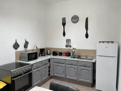 Cuisine ou kitchenette dans l'établissement Les Gîtes de Monthermé La Maison authentique du centre historique