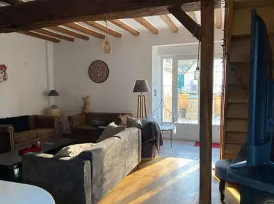 Coin salon dans l'établissement Chez Lilly & Cie 10 à 12 personnes avec sauna et piscine
