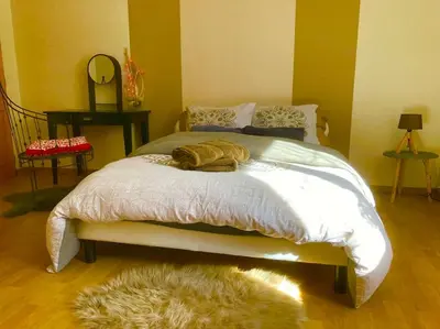 Un ou plusieurs lits dans un hébergement de l'établissement Chez Lilly & Cie 10 à 12 personnes avec sauna et piscine