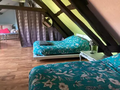 Un ou plusieurs lits dans un hébergement de l'établissement Chez Lilly & Cie 10 à 12 personnes avec sauna et piscine