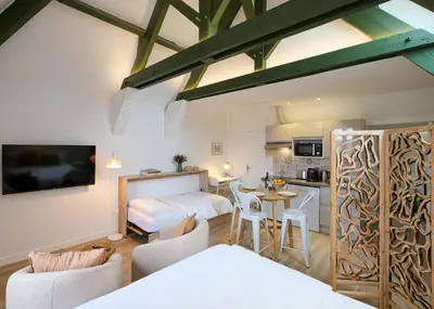 Un ou plusieurs lits dans un hébergement de l'établissement Villa Forestière Studio l'Olivier