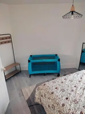 Un ou plusieurs lits dans un hébergement de l'établissement Superbe appartement bien placé