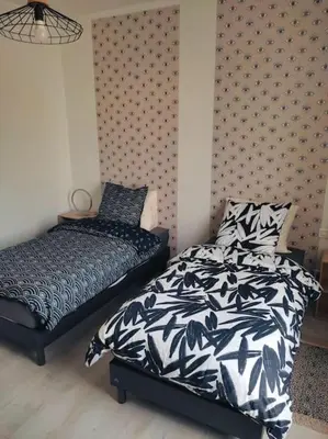 Un ou plusieurs lits dans un hébergement de l'établissement Superbe appartement bien placé