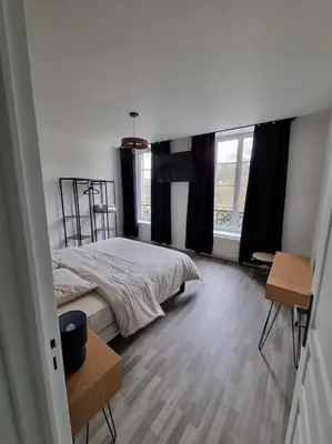 Un ou plusieurs lits dans un hébergement de l'établissement Appartement Jungle- hypercentre -Charleville