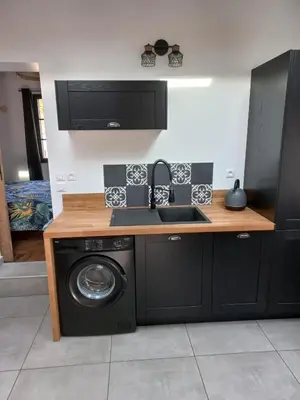 Cuisine ou kitchenette dans l'établissement Villa Cosy Pierrefonds