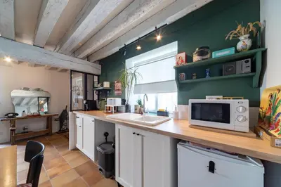 Cuisine ou kitchenette dans l'établissement Le Clos de la Tour