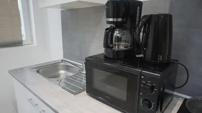 Cuisine ou kitchenette dans l'établissement Grand T2 Jardin Wifi Parking Proche Gare