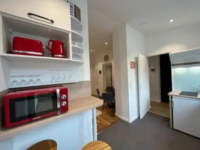 Cuisine ou kitchenette dans l'établissement Suite Clovis 2