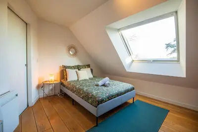 Un ou plusieurs lits dans un hébergement de l'établissement Loft les deux cèdres avec vue panoramique