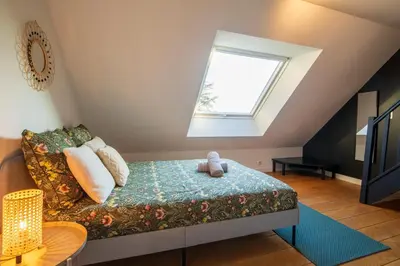 Un ou plusieurs lits dans un hébergement de l'établissement Loft les deux cèdres avec vue panoramique