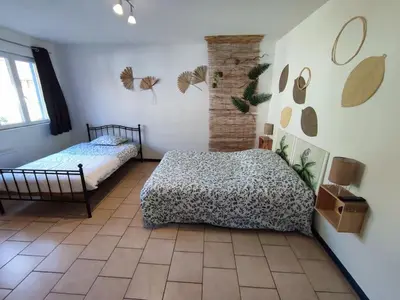 Un ou plusieurs lits dans un hébergement de l'établissement Maison individuelle 60 m²