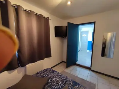 Télévision ou salle de divertissement dans l'établissement Maison individuelle 60 m²
