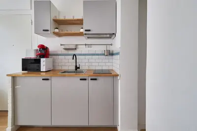Cuisine ou kitchenette dans l'établissement Le Domaltitute - Basilique Saint-Rémi