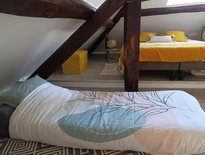 Un ou plusieurs lits dans un hébergement de l'établissement La Marisa, studio cosy 10min Disney.