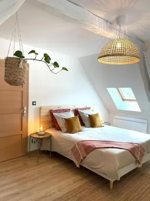 Un ou plusieurs lits dans un hébergement de l'établissement Maison de vacances dans un village de charme