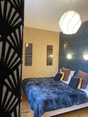 Un ou plusieurs lits dans un hébergement de l'établissement LOGIS HOTEL BELLEVUE RESTAURANT LA POMME d'OR