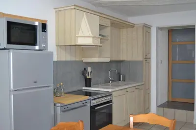Cuisine ou kitchenette dans l'établissement L'Escale des remparts