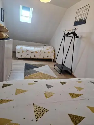 Un ou plusieurs lits dans un hébergement de l'établissement Gîte la crinière au vent