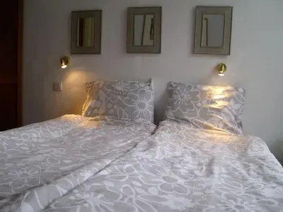 Un ou plusieurs lits dans un hébergement de l'établissement Hotel de la Gare