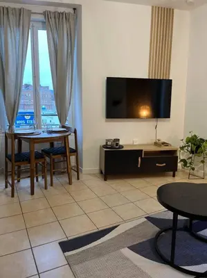 Télévision ou salle de divertissement dans l'établissement Le Clos