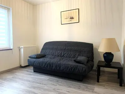 Coin salon dans l'établissement Appartement proche basilique Saint Rémi