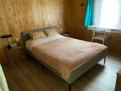 Un ou plusieurs lits dans un hébergement de l'établissement Chalet romantique Terrasse privée Île aux Palmiers