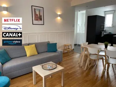 Coin salon dans l'établissement Le cinquante-deux appartement de Charme
