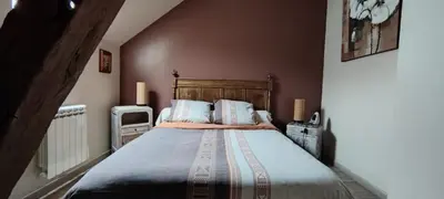Un ou plusieurs lits dans un hébergement de l'établissement La Hulottière Chouette Gîte