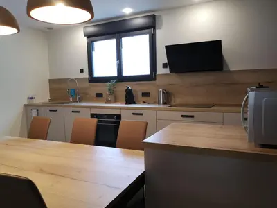 Télévision ou salle de divertissement dans l'établissement Gîte la Winery