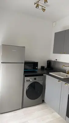 Cuisine ou kitchenette dans l'établissement Reims Detente