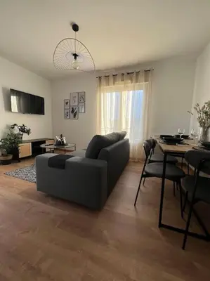 Coin salon dans l'établissement Appartement proche Disneyland