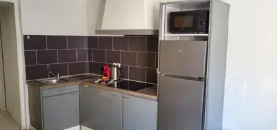 Cuisine ou kitchenette dans l'établissement Triangle d'or - Calme et Cosy, Appartement 1 chambre