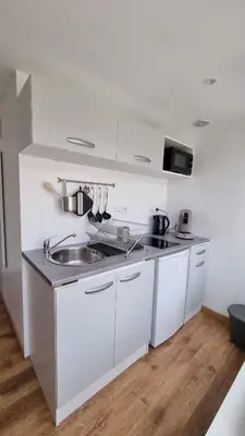 Cuisine ou kitchenette dans l'établissement Le petit Château Avesnois - Studio en rez-de-chaussée