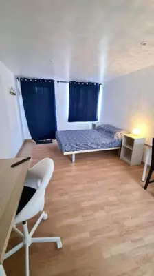 Un ou plusieurs lits dans un hébergement de l'établissement Le petit Château Avesnois - Studio en rez de jardin avec terrasse privée