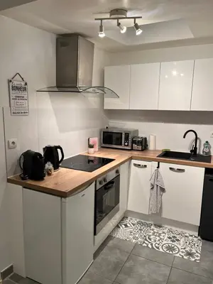 Cuisine ou kitchenette dans l'établissement Le Rémois studio cosy hyper centre