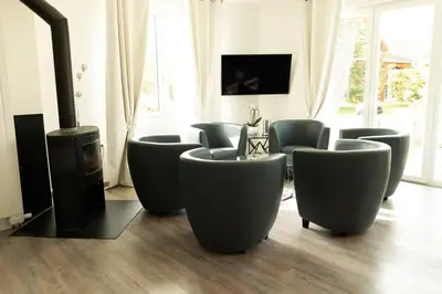 Télévision ou salle de divertissement dans l'établissement Gite L'orchidée