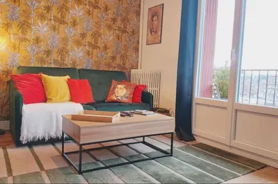 Coin salon dans l'établissement T1 cocooning à l’Hôtel de Ville